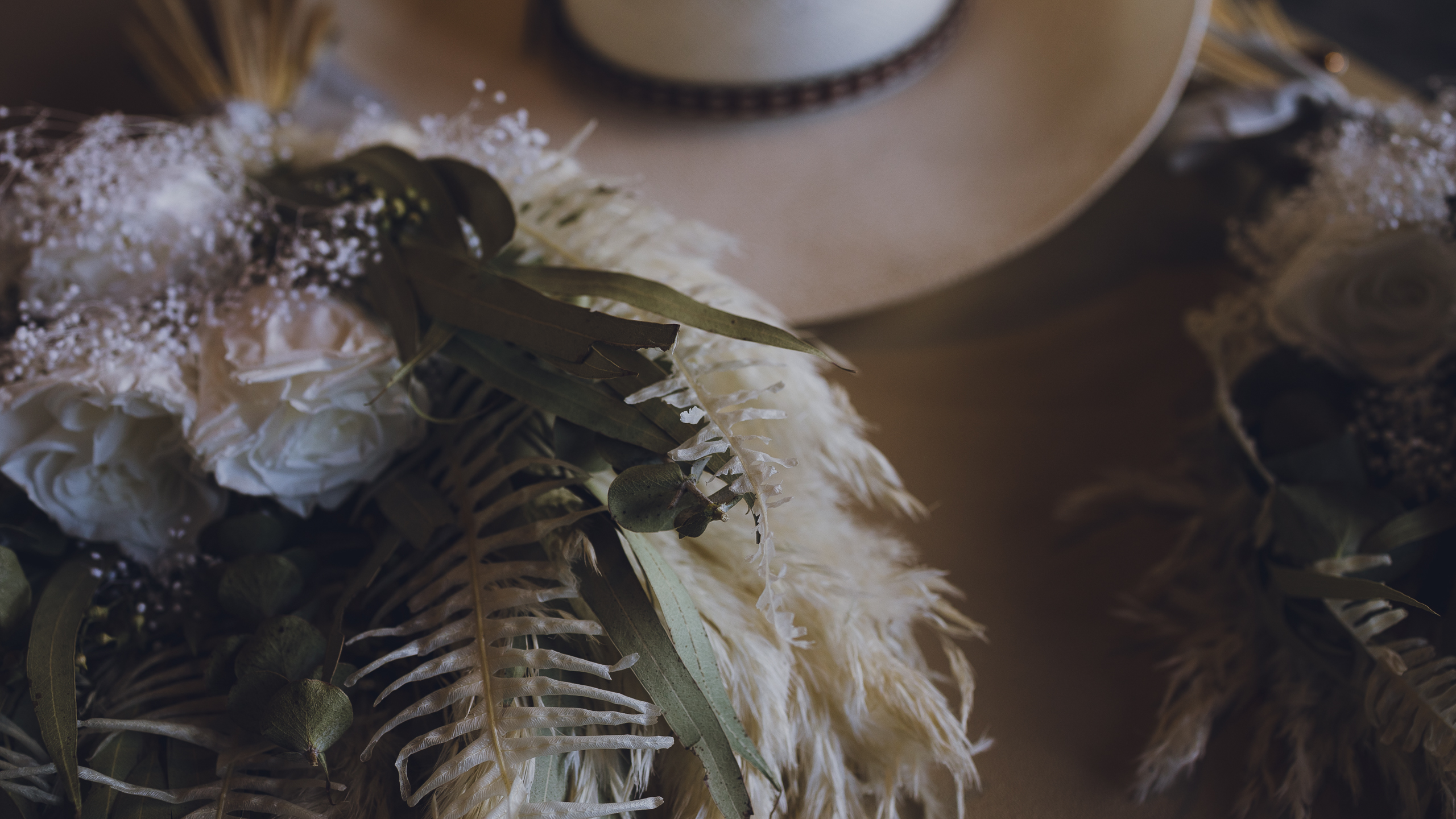 Annali and Daniel's wedding details of the bouquets and cowboy hats at Giant's Ridge Resort