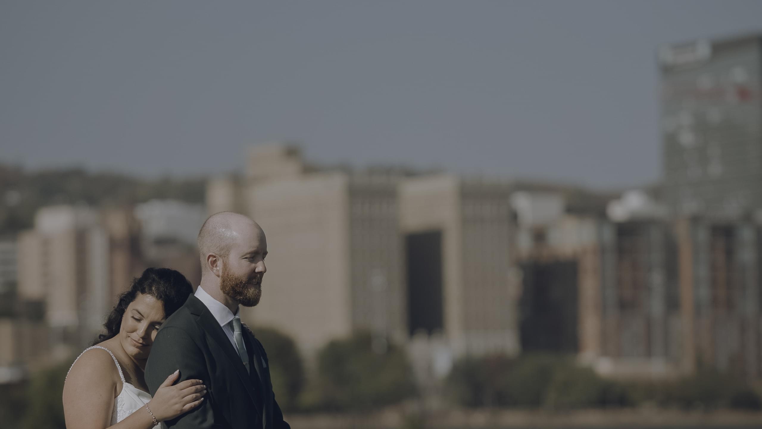 Melissa and Ryan sharing a romantic moment on The Lakewalk for their fall Duluth wedding