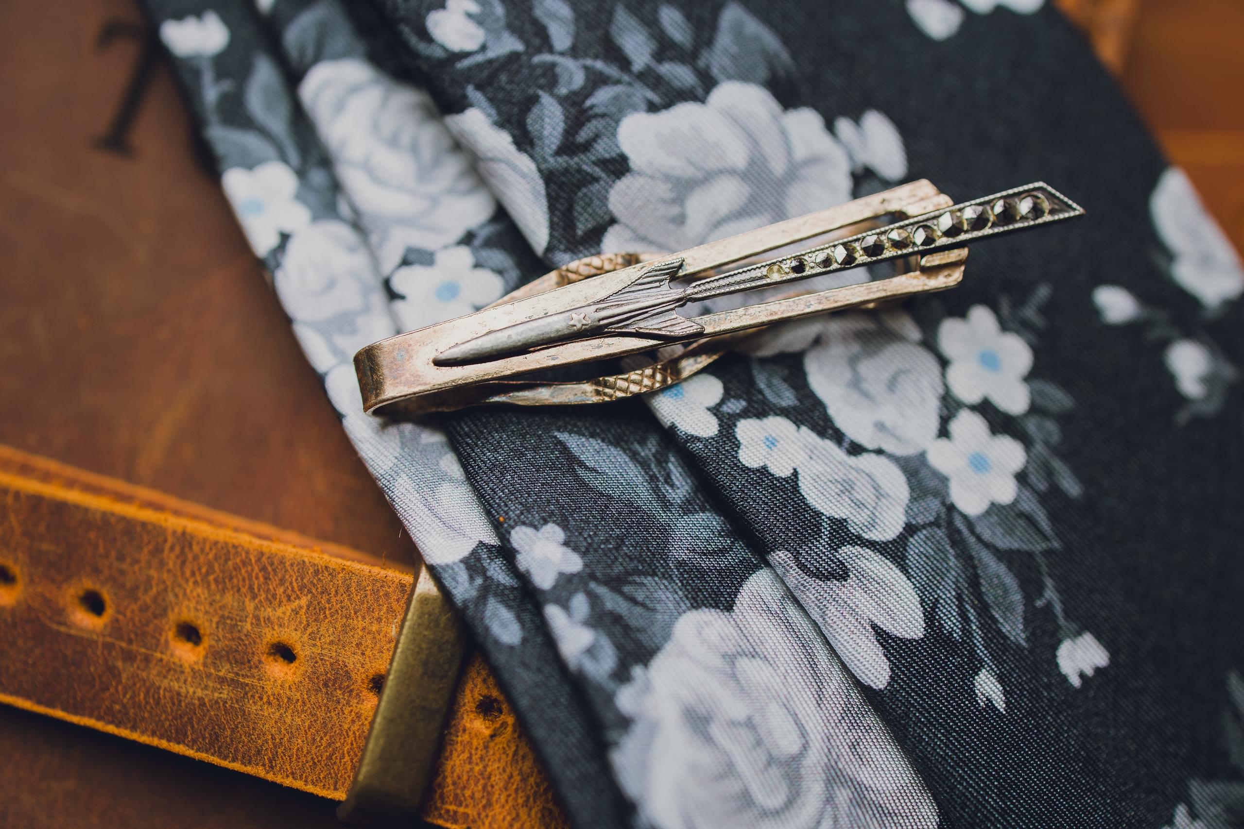 Fall wedding details with jewel tones and vintage accents at The Riverside venue